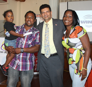 Minister of Transport Chandresh Sharma poses with Vanessa Villafana-Diaz, right, her husband Ramon and their son Malachi at the launch yesterday of the National Road Safety Awareness Campaign, at the Petrotrin Staff Club in Pointe-a-Pierre. Vanessa was the winner of the ministry’s Road Safety Slogan Campaign on FaceBook. PHOTO: RISHI RAGOONAT