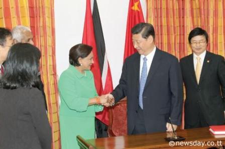 Prime Minister Kamla Persad-Bissessar greets President of China, Xi Jinping at the start of a two-day State visit to Trinidad and Tobago yesterday.  Author: RATTAN JADOO