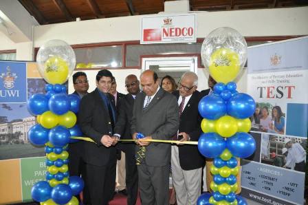 Minister of Tertiary Education and Skills Training, Fazal Karim (centre), NEDCO CEO, Ramlochan Ragoonanan; Permanent Secretary Ministry of Labour and Small and Micro Enterprise Development Mr. Carl Francis (L), and Campus Principal, Clemant Sankat