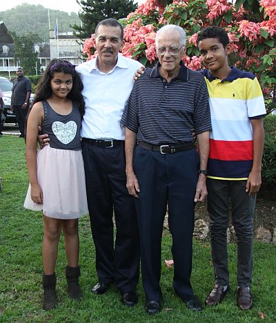 President Anthony Carmona stands proudly with two children, Anura, left and son Christian, looking on is Carmona’s father Dennis Stephen Carmona.