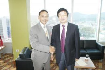 Minister of Trade, Industry and Investment, the Honourable Vasant Bharath with His Excellency Huang Xing Yuan