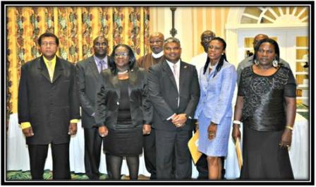Above: The Attorney General poses with appointees at the Tobago function on March 8, 2013.