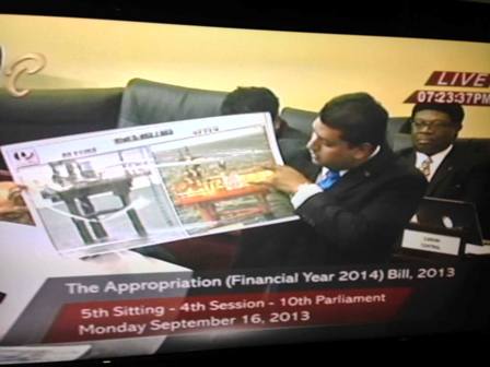 Energy Minister Kevin Ramnarine (Sept 16) in the Parliament shows a before and after picture of a Trinmar facility.