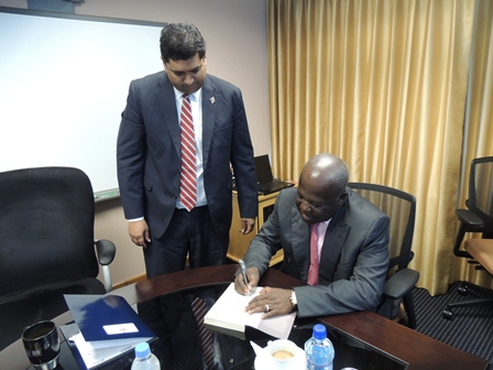 Sir Sam Jonah, Chairman of Range Resources autographs a copy of his book “Sam Jonah and the remaking of the Ashanti” for Energy Minister Kevin RamnarineSir Sam Jonah, Chairman of Range Resources autographs a copy of his book “Sam Jonah and the remaking of the Ashanti” for Energy Minister Kevin Ramnarine