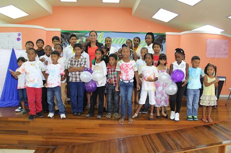 MP Ramona Ramdial poses with graduating participants of the Bank Village Vacation Camp