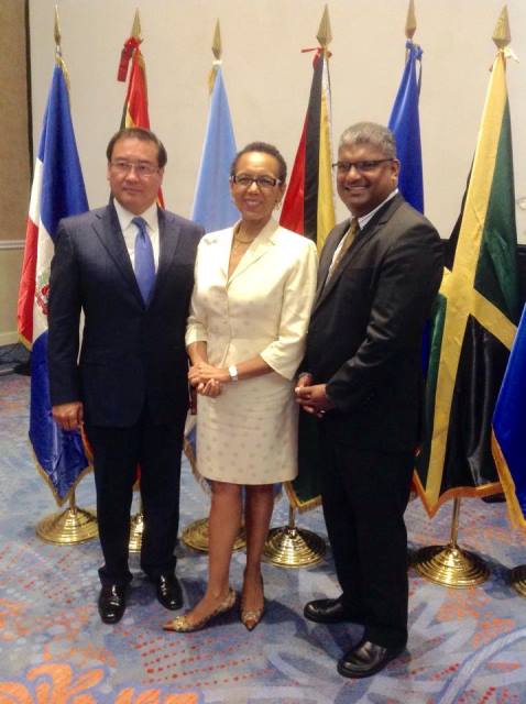 In Picture: AG for El Salvador Hon. Luis Antonio Martinez Gonzalez and newly elected Deputy Chair Hon. Anand Ramlogan chat with outgoing Chair AG for the Bahamas Hon. Allison Maynard-Gibson.