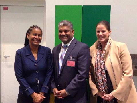The Deputy Directors of CFATF, Dawn Spicer and Diana Firth greet AG Anand Ramlogan