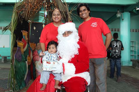 Santa Photo-op: Couva North MP, Ramona Ramdial (left) poses with her husband, Devindra Barrath (right) and son Rudra