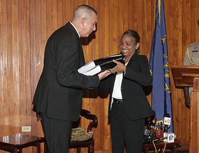 President Anthony Carmona receives the report of the commission of enquiry into Clico from secretary to the commission, Judith Gonzales, at the Office of the President, St Ann's,. PHOTO: NICOLE DRAYTON: GUARDIAN 