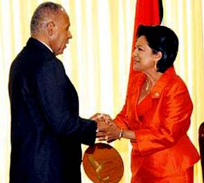 Kamla Persad-Bissessar, SC, MP Leader of the Opposition and the late Patrick Manning 